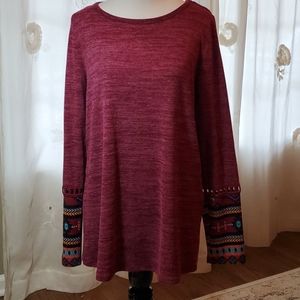 Long sleeve short with Aztec design on sleeves.